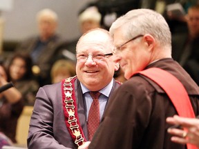 Gino Donato/The Sudbury Star/QMI Agency
Mayor Brian Bigger is congratulated by the Honourable Justice Richard Humphrey after receiving his chain of office during the inaugural ceremony in 2014 for city council.