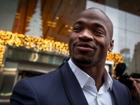 Suspended Vikings running back Adrian Peterson exits following his hearing against the NFL over his punishment for child abuse in New York on Tuesday, Dec. 2, 2014. (Brendan McDermid/Reuters)
