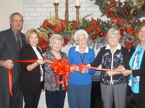 Wallaceburg's Oaks Inn Retirement held a  ribbon cutting ceremony on Dec. 2. The retirement facility opened their doors to residents last month. Taking part in the ribbon cutting ceremony were, from left, Chatham-Kent mayor Randy Hope, councillor Carmen McGregor, residents Mariette Cornelius, Florence Riedl, Nina Klompstra and general manager Linda Schell. The facility will host a holiday open house on Dec. 12 from 1-4 p.m. The event will be open to the local community and will include entertainment, food and a door prize.