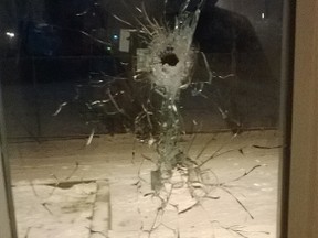 The intended target of the city's 41st shooting of 2014 took this photo of the damage to his front window after a masked man shot at him three times Tuesday night at a home on Elmira Dr. (OTTAWA SUN Submitted image)