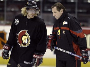 Former Sens coach Jacques Martin talks with Daniel Alfredsson during a 2003 practice. Martin, now an executive with Pittsburgh, says he leaned heavily on his captain to get the pulse of the dressing room. OTTAWA SUN FILES