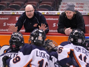 Henric Alfredsson (left) got a helping hand from his older brother Daniel two years ago at the Bell Capital Cup. (SUBMITTED PHOTO)