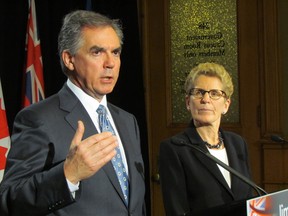 Ontario Premier Kathleen Wynne and Alberta Premier Jim Prentice meet on December 3, 2014 at Queen's Park. (Antonella Artuso/Toronto Sun)