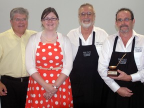 United Way of Elgin-St. Thomas board president James Todd, left, and campaign and communications coordinator Melissa Schneider stand with Richard Bisson and Brad Myall of Park Place Catering at the United Way's Supreme Soup Challenge in September.

File photo