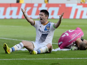 Los Angeles Galaxy forward Robbie Keane (7) reacts after a save by Seattle Sounders goalkeeper Stefan Frei during the MLS Western Conference Championship at StubHub Center. (Kelvin Kuo/USA TODAY Sports)
