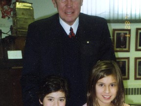Sisters Annie, left, and Grace Kennedy with Jean Beliveau in January 2005. The photo was taken by the girls’ proud pop, Whig-Standard columnist Patrick Kennedy.
