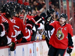 Daniel Alfredsson is congratulated by his teammates after his goal against the Buffalo Sabres in this Feb. 5, 2013, file photo.  (REUTERS)