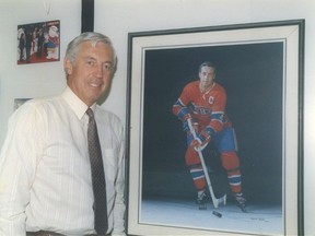 Jean Beliveau stands next to a portrait of himself in his playing days. (QMI Agency photo)