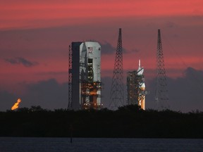 The Delta IV Heavy rocket carrying the Orion spacecraft sits on the launch pad awaiting liftoff in the sunrise at the Cape Canaveral Air Force Station in Cape Canaveral, Fla., on December 4, 2014. (REUTERS/Scott Audette)