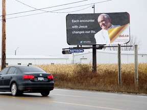 A billboard, paid for by the Roman Catholic Diocese of London and featuring a photo of Pope Francis, stands along Oxford Street East in London on Wednesday December 3, 2014.  (CRAIG GLOVER, The London Free Press)
