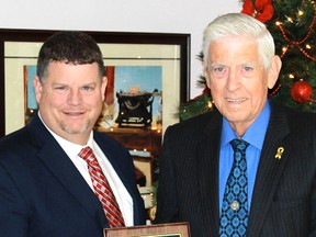 Lambton County Warden Todd Case presents former councillor Jim Foubister with the Warden's Citizen of the Month. Foubister was recongized for his decades of volunteerism for organizations such as Huron House Boys' Home, Circles and the Inn of the Good Shepherd. (CARL HNATYSHYN, QMI Agency)
