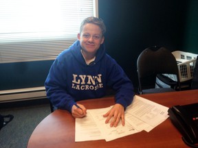 Woodstock's Greg Morissette, seen here signing his NCAA commitment form, will attend and play lacrosse for Lynn University in Boca Raton, Flor.  at the start of the 2015-16 season. Morissette, 17, is a former St. Mary's Catholic High School student and is attending The Hill Academy in Vaughan. (Submitted photo)