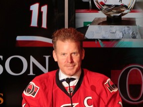 Daniel Alfredsson looks up as reads a prepared speech during his retirement press conference at the Canadian Tire Centre Thursday morning. (TONY CALDWELL Ottawa Sun)