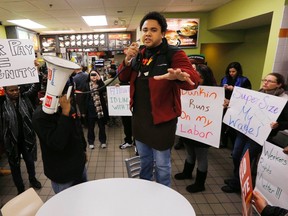 Scores of fast food workers and their supporters calling for a $15 minimum wage fill a McDonalds restaurant in Chelsea, Massachusetts December 4, 2014.  Workers in the fast-food, home care and airline industries are staging protests and strikes throughout the United States on Thursday to advocate for a $15 minimum wage and other labor rights. The protests are under a banner organization called "Fight for 15" and organizers say they expect Thursday's actions will represent the most expansive to date, increasing to a planned 160 cities from 150 in a similar nationwide protest in early September. REUTERS/Brian Snyder