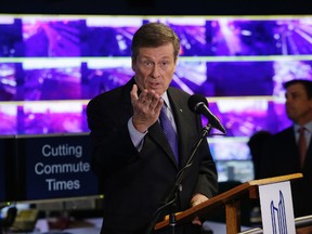 Mayor John Tory speaks to the media about the state of Toronto traffic on Thursday, Dec. 4, 2014. (CRAIG ROBERTSON/Toronto Sun)