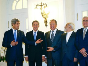 U.S. Secretary of State John Kerry, left to right, Britain's Foreign Secretary Philip Hammond, Russian Foreign Minister Sergei Lavrov, Iranian Foreign Minister Javad Zarif and German Foreign Minister Frank-Walter Steinmeier pose for photographers before a meeting in Vienna. Iran, the United States and other world powers are all but certain to miss Monday's deadline for negotiations to resolve a 12-year stand-off over Tehran's atomic ambitions, forcing them to seek an extension, sources say. (Leonhard Foeger/Reuters)