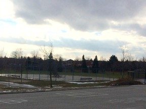 A middle-aged man was found dead at the rear of Lester an. Pearson Public School in Ajax, near a baseball diamond, early Thursday. No foul play is suspected. (CHRIS DOUCETTE/Toronto Sun)