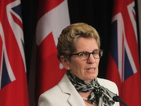 Premier Kathleen Wynne announces a package of initiatives to raise awareness of sexual violence and sexual harassment in Toronto on Thursday December 4, 2014. (Stan Behal/Toronto Sun)