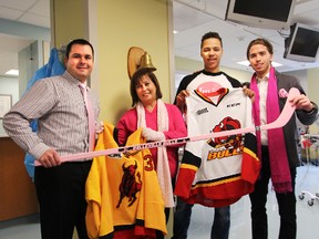 Belleville Bulls players Stephen Harper and Charlie Graham (right) join Bulls Director of Business Operations Andrew Kerik and Scotiabank's Ana Bento to promote February's Pink in the Rink event. Tim Miller/The Intelligencer