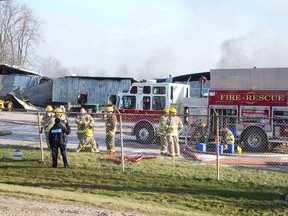 A large building housing two business, Weathertech Restoration and London Caulking was destroyed by fire in London, Ontario on Thursday, December 4, 2014. (DEREK RUTTAN, The London Free Press)