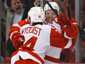 Detroit Red Wings right wing Daniel Alfredsson celebrates with centre Gustav Nyquist after scoring the game winning goal in overtime against the Pittsburgh Penguins at Joe Louis Arena. Rick Osentoski-USA TODAY Sports