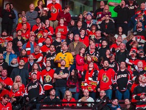 Ottawa Senators fans watch a video montage of Daniel Alfredsson's career at Canadian Tire Centre on Thursday Dec. 4, 2014. Errol McGihon/Ottawa Sun/QMI Agency