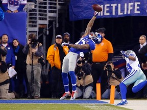 Giants receiver Odell Beckham Jr. makes a one-handed catch against the Cowboys. (USA TODAY SPORTS)