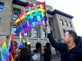 Ryan Massel was one of nearly 50 people to come out to the McDougall Centre Calgary for a Bill 10 protest in Calgary on Thursday December 4, 2014. Darren Makowichuk/Postmedia