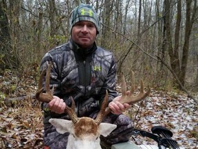 Jerry Kinnaman and the albino deer he killed with a bow and arrow.
(Facebook photo)