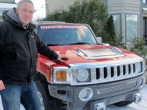 Yves Gauthier with his tuck in his driveway at his home in Boucherville, Que. (SARAH-MAUDE LEFEBVRE/QMI Agency)