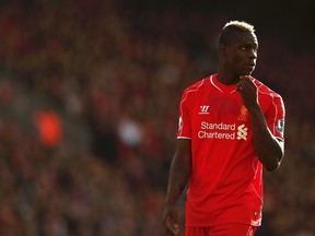 Liverpool's Mario Balotelli watches play during their English Premier League soccer match against Hull City at Anfield in Liverpool, northern England October 25, 2014. (REUTERS/Phil Noble)