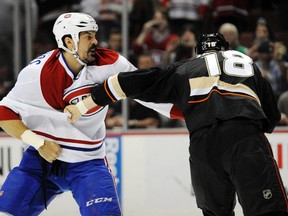 Montreal Canadiens right wing George Parros (15) and Anaheim Ducks right wing Tim Jackman (18) fight during the first period at Honda Center on Mar 5, 2014 in Anaheim, CA, USA. (Kelvin Kuo/USA TODAY Sports)