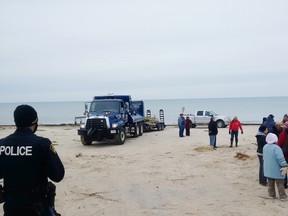 A barrier between Ipperwash Beach and the boundary of the former Ipperwash Provincial Park was removed Friday by members of the Chippewas of Kettle and Stony Point First Nation, igniting tension between the band and the local municipality, and attracting OPP. Chief Tom Bressette said the band is exercising jurisdiction over the historical trail by removing the barrier. (LINDA HILLMAN-RAPLEY, QMI Agency)