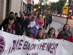 A group of about 100 people marched in downtown Sarnia in September during the community's 21st annual Take Back the Night demonstration. Holding the banner in this file photo are Kayla Collier, left, Tayleena Sullivan, Gabrielle Smith, Adelaide Smith, Jenna Regier, and Gary Parsons (not pictured). FILE PHOTO/ THE OBSERVER/ QMI AGENCY