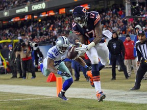 Chicago Bears wide receiver Alshon Jeffery (17) catches a touchdown pass over Dallas Cowboys cornerback Brandon Carr (39) during the second half at Soldier Field on Dec 4, 2014 in Chicago, IL, USA. (Dennis Wierzbicki/USA TODAY Sports)