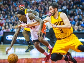 Raptors’ Lou Williams (left) chases down the ball with the Cavaliers’ Kevin Love at the Air Canada Centre last night. (Ernest Doroszuk/Toronto Sun)
