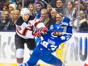 Maple Leafs forward Nazem Kadri is put in a nasty position by Andy Greene of the Devils on Thursday, and then was the target of a verbal shot from head coach Randy Carlyle on Friday. (ERNEST DOROSZUK/Toronto Sun)