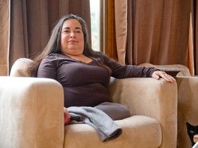 Thalidomide survivor Lianne Powell sits in her home in London. (Free Press file photo)