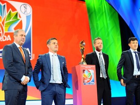 Head coaches for group A for the upcoming 2015 FIFA Women's World Cup, from left, Roger Reijners (Netherlands), John Herdman (Canada), Tony Readings (New Zealand) and Hao Wei (China). DEAN JONCAS/PHOTO