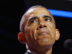 U.S. President Barack Obama pauses as he talks at the Summit on College Opportunity while at the Ronald Reagan Building and International Trade Center in Washington, Dec. 4, 2014. REUTERS/Larry Downing