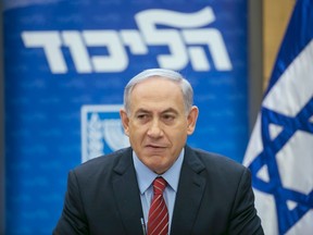 Israeli Prime Minister Benjamin Netanyahu speaks during a Likud party meeting at the parliament in Jerusalem December 3, 2014. (REUTERS/Baz Ratner)