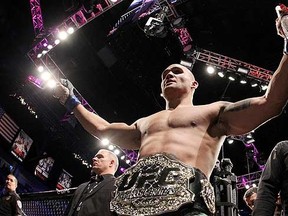Robbie Lawler celebrates after defeating Johny Hendricks by a split decision in their welterweight title fight during the UFC 181 event at the Mandalay Bay Events Center on December 6, 2014 in Las Vegas, Nevada. (Alex Trautwig/Getty Images/AFP)