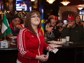 Rosanne Pinchin watches the final schedule draw for the FIFA Women’s World Cup Canada 2015 at The Pint Public House & Sports Bar on Saturday. (David Bloom, Edmonton Sun)