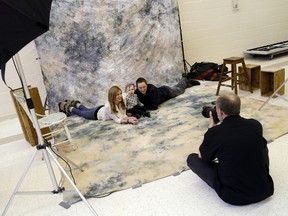 Willy Parks and Jessica Lynch with little Riley get their photos taken during Help Portrait at Bridge Street United Church Saturday, Dec. 6, 2014. 
EMILY MOUNTNEY-LESSARD/THE INTELLIGENCER/QMI AGENCY