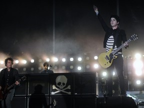 Green Day's Billie Joe Armstrong (R) and Jason White (L) perform during the Bilbao BBK Live music festival, on July 13, 2013, in the Northern Spanish Basque city of Bilbao.  (AFP PHOTO/RAFA RIVAS)