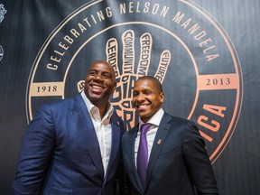 Former NBA star Magic Johnson (left) and Toronto Raptors president and GM Masai Ujiri on the red carpet at the Air Canada Centre during Giant of Africa event honouring the late Nelson Mandela in Toronto, Ont. on Friday December 5, 2014. (Ernest Doroszuk/Toronto Sun)