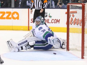 Vancouver Canucks goalie Ryan Miller (30) is beaten on a goal scored by Toronto Maple Leafs Richard Panik (not pictured) at Air Canada Centre Dec 6, 2014. (Tom Szczerbowski-USA TODAY Sports)