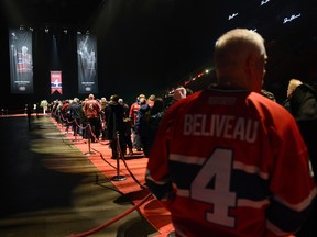 Fans line up to pay their respects during the public viewing for Montreal Canadiens hockey legend Jean Beliveau in Montreal, December 7, 2014. Beliveau died at the age of 83. (REUTERS/Paul Chiasson/Pool)
