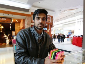 Ahsen Qurshei,  who runs a phone accessories store at Eglinton Square mall, says sales are going strong. (MICHAEL PEAKE, Toronto Sun)