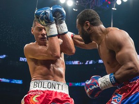 Jean Pascal (blue-red pants) facing Roberto Bolonti (red pants) at the Bell Centre in Montreal on Saturday, December 6, 2014. (JOEL LEMAY/QMI AGENCY)